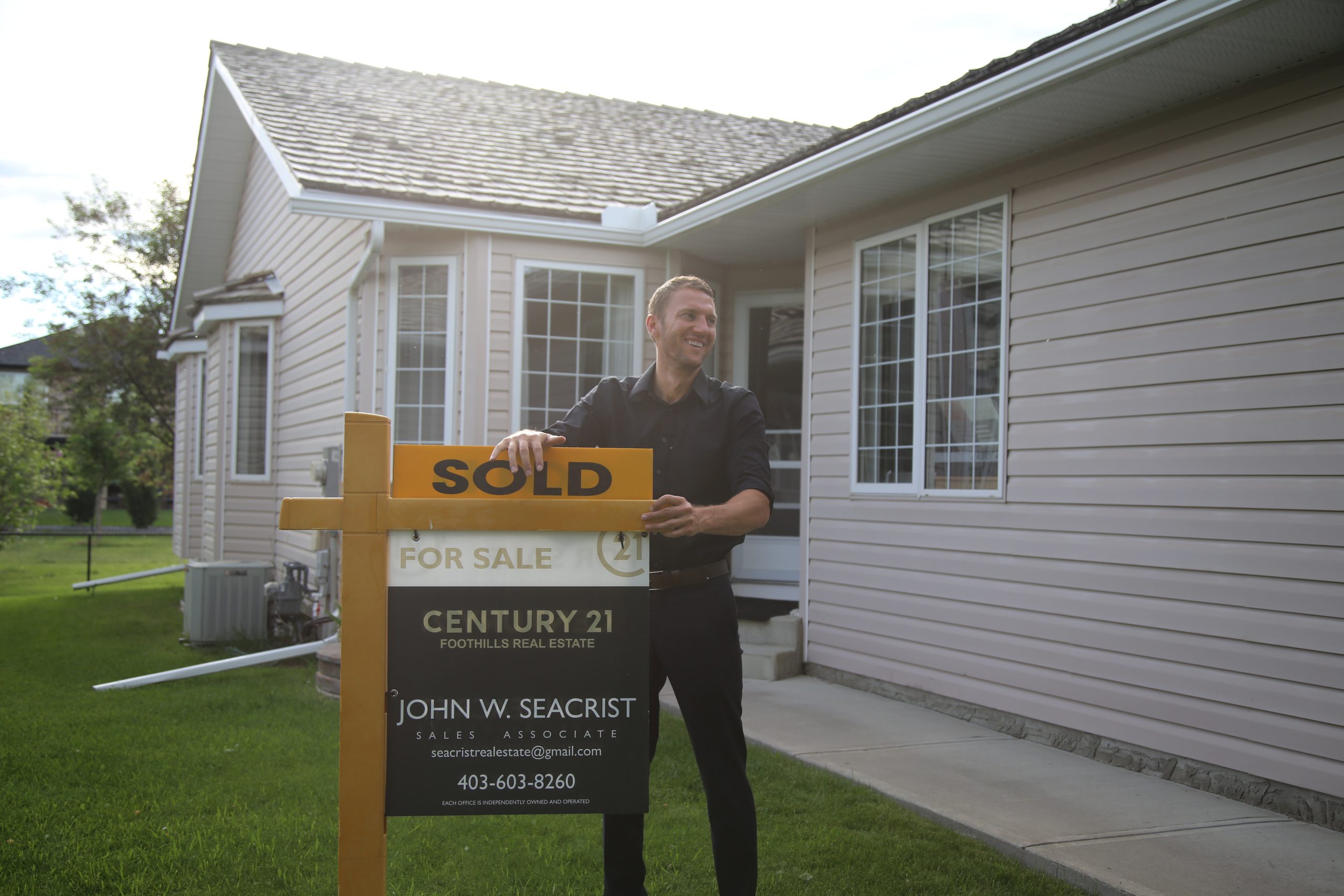 John Seacrist with sold sign